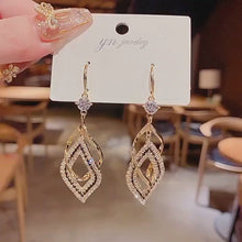 Load and play video in Gallery viewer, Vintage Geometric Earrings Pendant exquisite Hollow out Hanging Earrings
